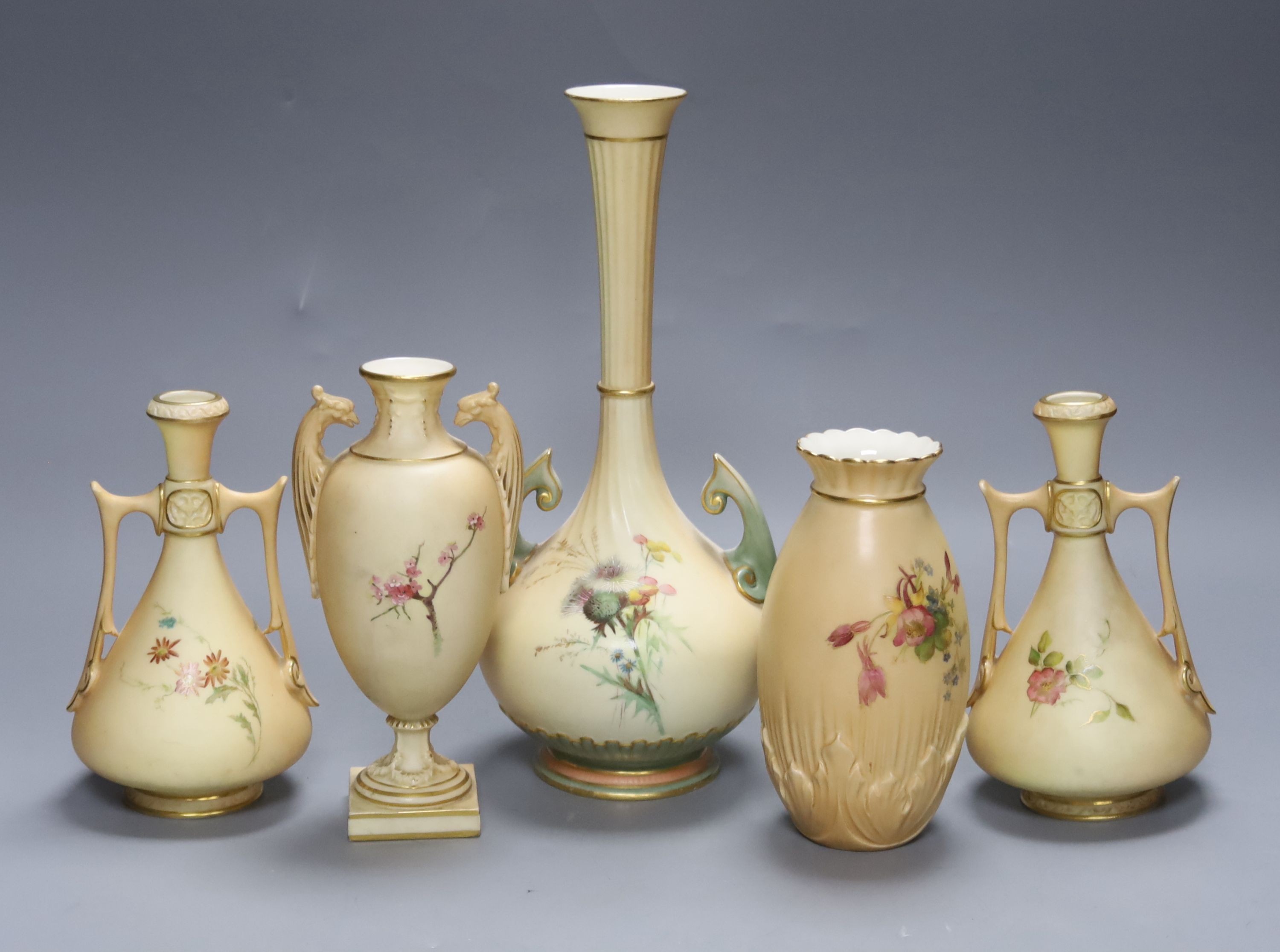 A group of Royal Worcester blush ivory - a pair of vases, and three other vases, 25cm